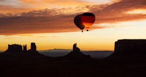 Balloon highline above monument valley at sunrise